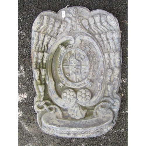 538 - A heavy lead armorial panel, with central heraldic shield and devices, 50 x 33cm.