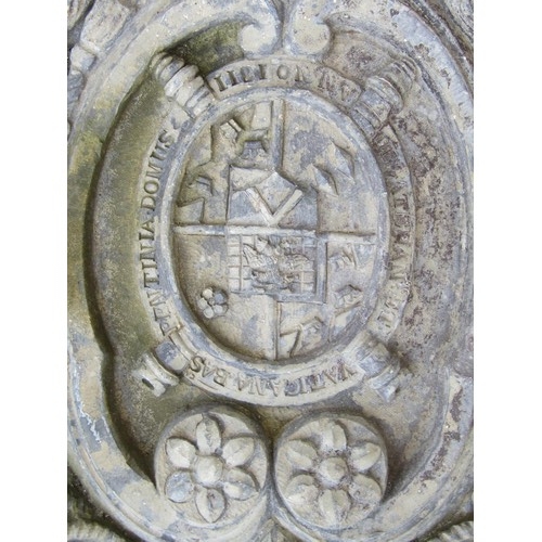 538 - A heavy lead armorial panel, with central heraldic shield and devices, 50 x 33cm.