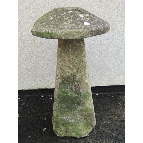 546 - A weathered natural limestone staddle stone and cap, 95cm high, 58cm diameter apprrox