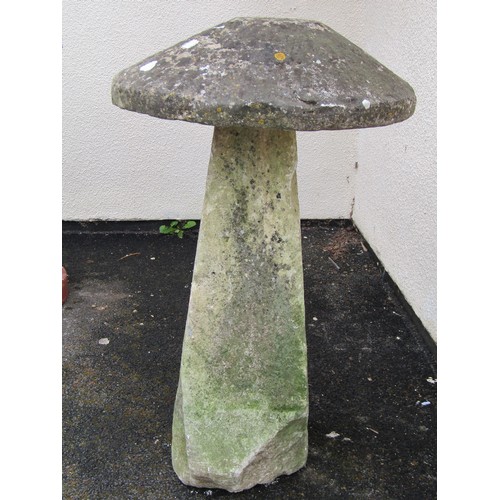 546 - A weathered natural limestone staddle stone and cap, 95cm high, 58cm diameter apprrox