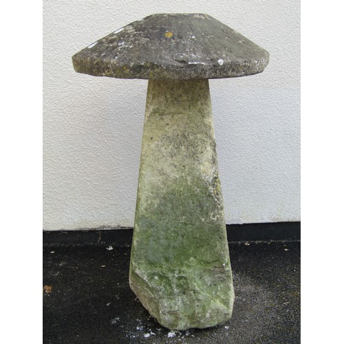 546 - A weathered natural limestone staddle stone and cap, 95cm high, 58cm diameter apprrox