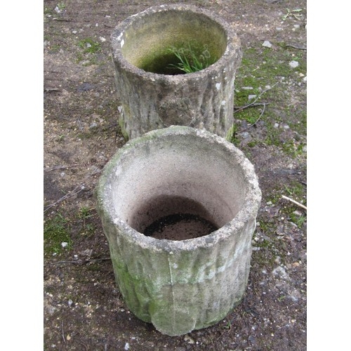 197 - A pair of weathered cast composition stone garden planters in the form of tree stumps, 29cm high, 30... 