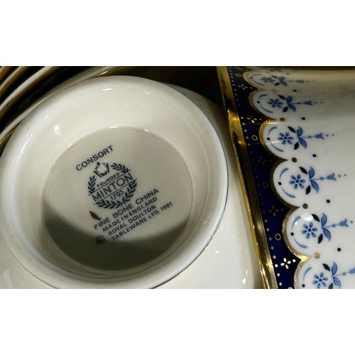 8 - A collection of Minton Consort tea and dinner ware for six with repeating blue and gilt detail