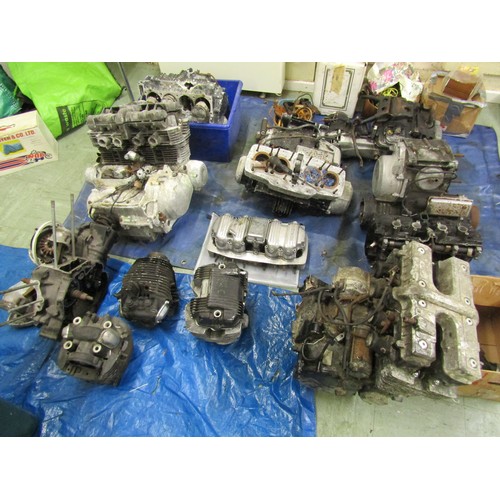 571 - Five motorcycle engine/blocks, together with various cylinder heads etc