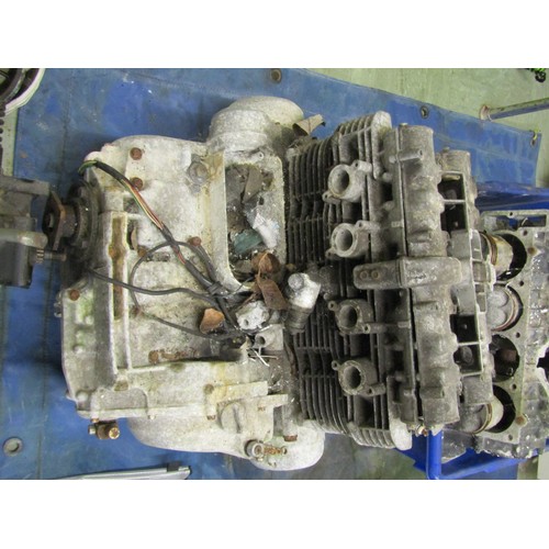 571 - Five motorcycle engine/blocks, together with various cylinder heads etc