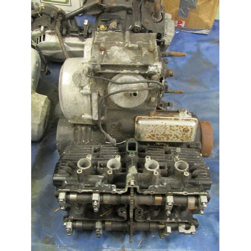 571 - Five motorcycle engine/blocks, together with various cylinder heads etc