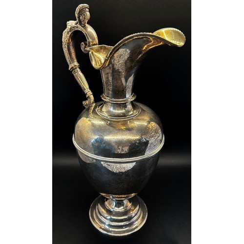 135 - A late Victorian silver claret jug with a scrolled female handle, London 1901 maker George fox, 30cm... 