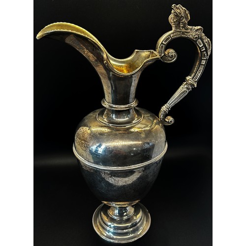 135 - A late Victorian silver claret jug with a scrolled female handle, London 1901 maker George fox, 30cm... 