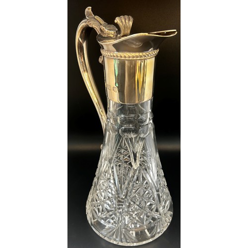 136 - A late 20th century cut glass Georgian style claret jug with a silver collar spout and handle, Birmi... 