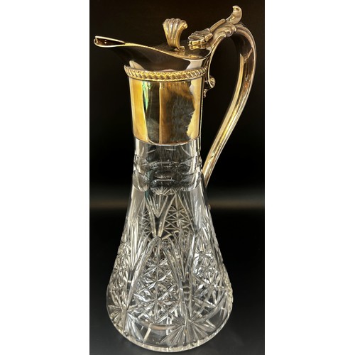 136 - A late 20th century cut glass Georgian style claret jug with a silver collar spout and handle, Birmi... 