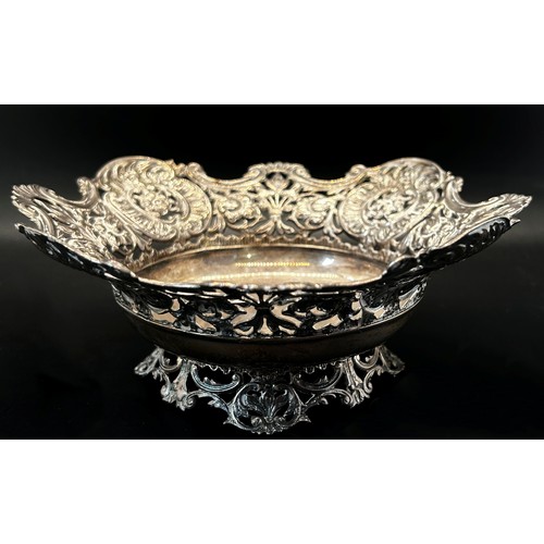 143 - A late Victorian silver dish with pierced floral sides, London 1895, makers marks rubbed, 17cm diame... 