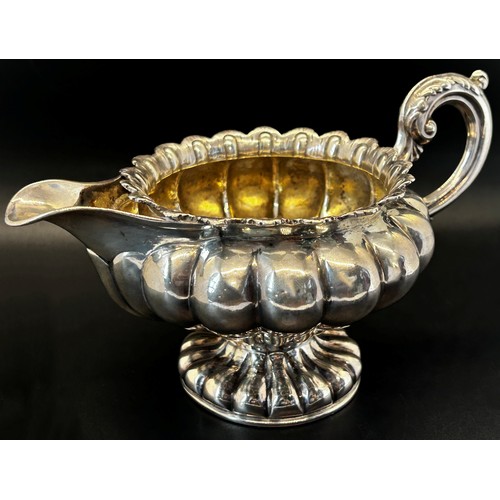 144 - A William IV silver creamer of squat pumpkin form, London 1834, maker Benoni Stephens, 19cm wide, 8.... 