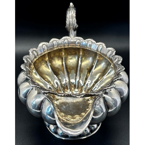 144 - A William IV silver creamer of squat pumpkin form, London 1834, maker Benoni Stephens, 19cm wide, 8.... 