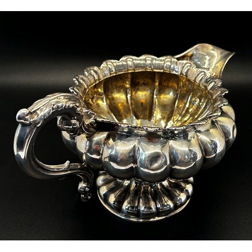 144 - A William IV silver creamer of squat pumpkin form, London 1834, maker Benoni Stephens, 19cm wide, 8.... 