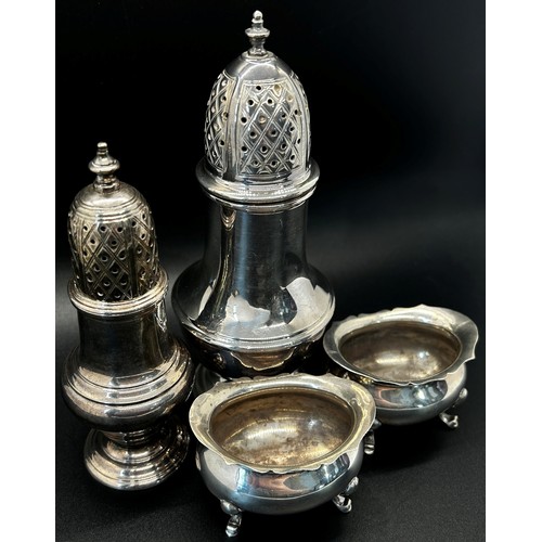 146 - A Georgian style silver sugar castor, 15cm high, together with another smaller, 11cm high and a pair... 