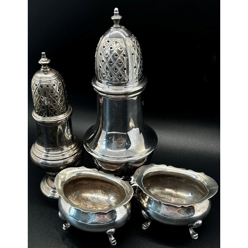 146 - A Georgian style silver sugar castor, 15cm high, together with another smaller, 11cm high and a pair... 