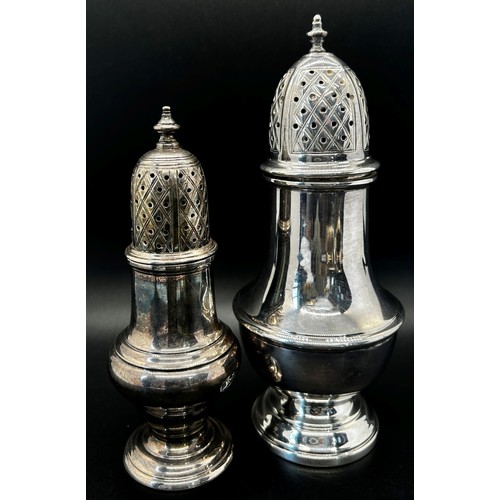 146 - A Georgian style silver sugar castor, 15cm high, together with another smaller, 11cm high and a pair... 