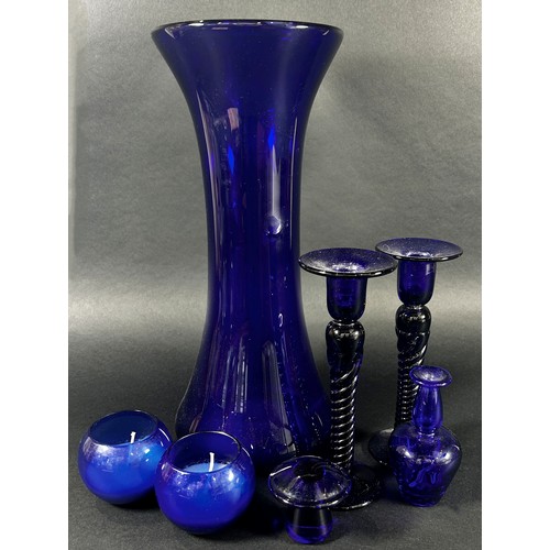 97 - A Group of Bristol Blue Glass ware including a tall waisted vase, 35cm high, a pair of candlesticks ... 