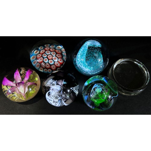 100 - Six paperweights, flowers, Millefiori , swirls and bubbles etc and a single clear weight