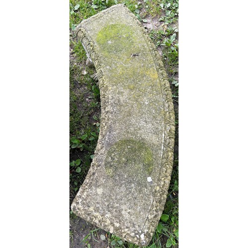 144 - A weathered three-sectional cast composition stone garden bench, the curved slab seat with tongue bo... 