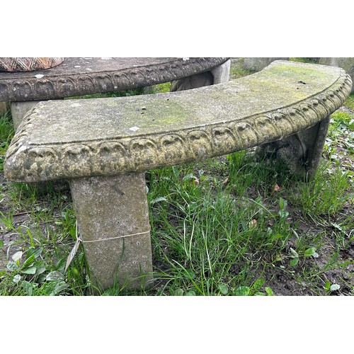 144 - A weathered three-sectional cast composition stone garden bench, the curved slab seat with tongue bo... 