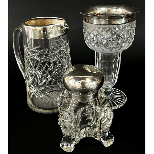 147 - A substantial cut glass inkwell with a silver hinged cap (chip to base)  cut glass jug with silver c... 