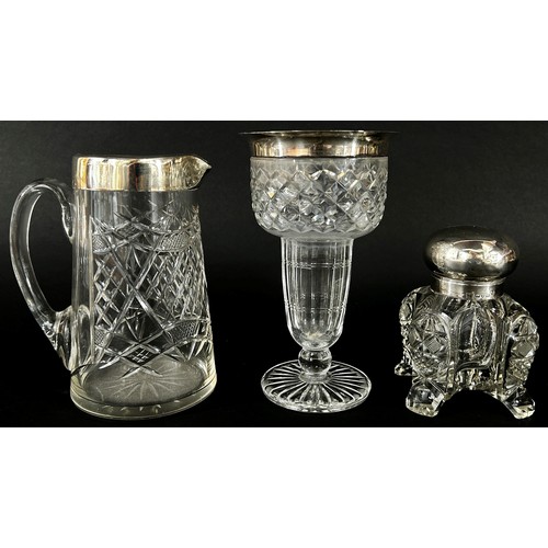 147 - A substantial cut glass inkwell with a silver hinged cap (chip to base)  cut glass jug with silver c... 