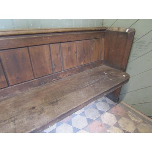1022 - A large Victorian pine church pew with panelled back, 3.5m long