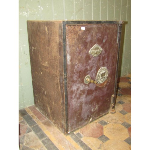1029 - A Whittingham Brothers fire and Thief Resisting Safe with brass mounts (key in office) 67cm high x 3... 