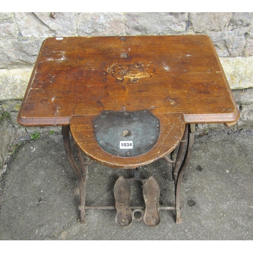 1044 - A vintage cast iron treadle sewing machine base with scumbled wooden top