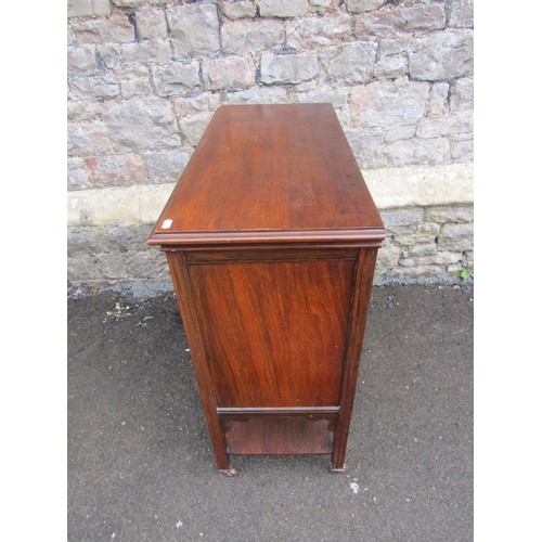 1122 - An Edwardian mahogany music cabinet enclosed by a series of 6 drawers and a side door