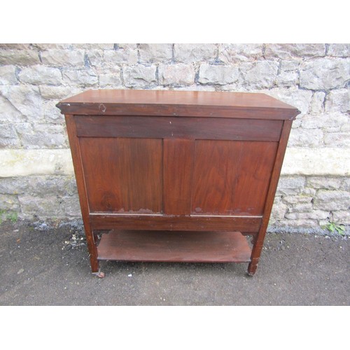 1122 - An Edwardian mahogany music cabinet enclosed by a series of 6 drawers and a side door