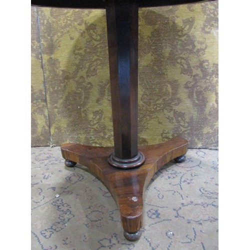 1147 - A small 19th century rosewood veneered occasional table of circular form raised on an octagonal pill... 