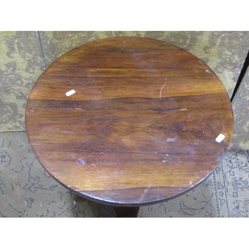 1147 - A small 19th century rosewood veneered occasional table of circular form raised on an octagonal pill... 