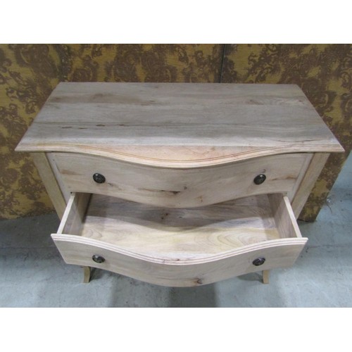 1161 - A hard  wood serpentine chest of three drawers on shaped supports, 100cm wide