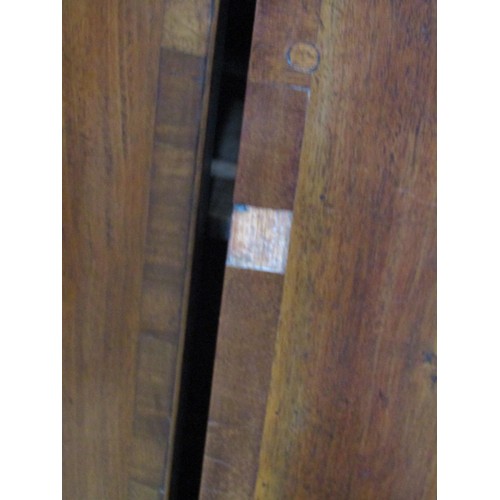 1163 - A Georgian mahogany bow front hanging corner cupboard