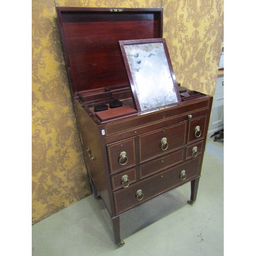 1197 - A Georgian mahogany gentleman's wash stand with rising lid, with comprehensively fitted interior, in... 