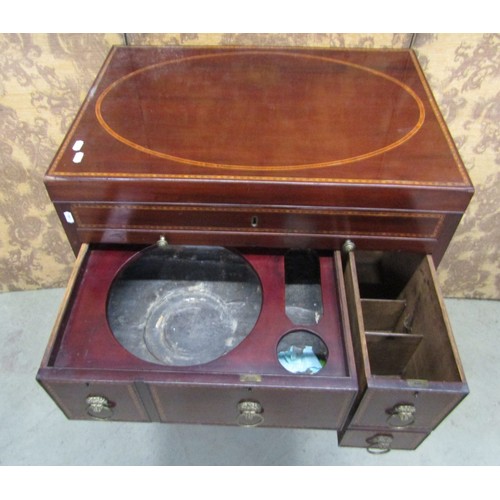 1197 - A Georgian mahogany gentleman's wash stand with rising lid, with comprehensively fitted interior, in... 