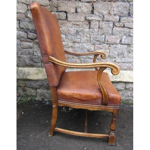 1229 - An open armchair in the Georgian style with tan coloured hide upholstered seat and back