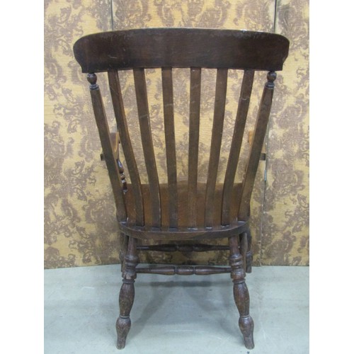 1232 - A Windsor lathe back chair with wide body and elm seat