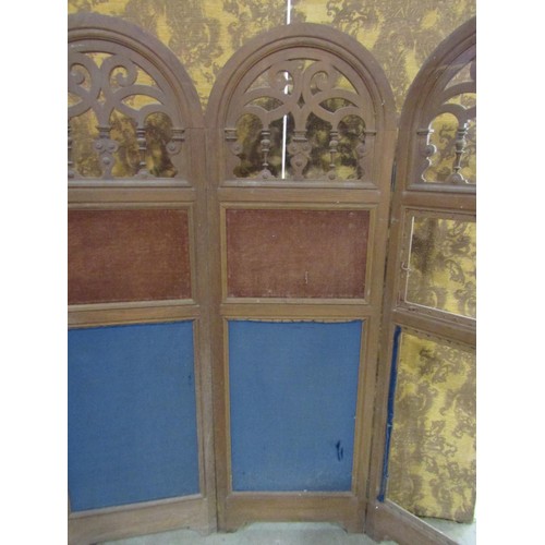 1240 - A 19th century oak framed four panelled room divider with arched and pierced panels  and further uph... 