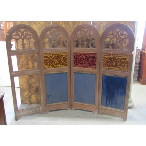 1240 - A 19th century oak framed four panelled room divider with arched and pierced panels  and further uph... 