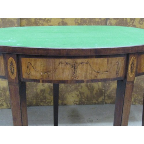 1241 - A Georgian mahogany demi lune card table with marquetry finish