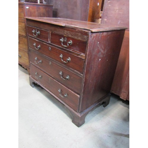 1191 - A Georgian mahogany bedroom chest of two short over three long graduated drawers set on bracket feet... 