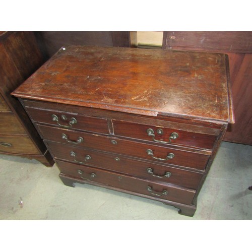 1191 - A Georgian mahogany bedroom chest of two short over three long graduated drawers set on bracket feet... 