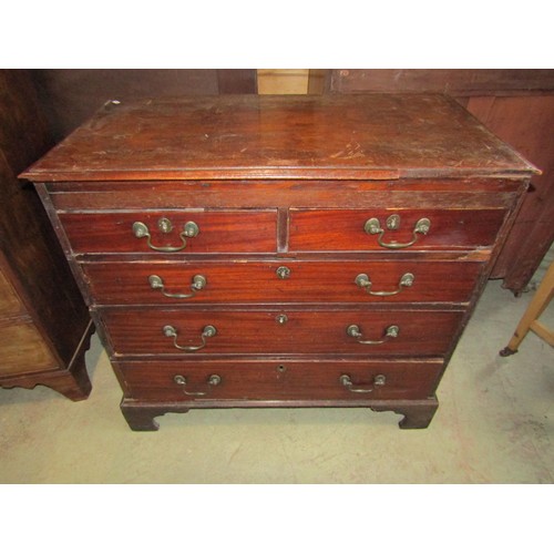 1191 - A Georgian mahogany bedroom chest of two short over three long graduated drawers set on bracket feet... 