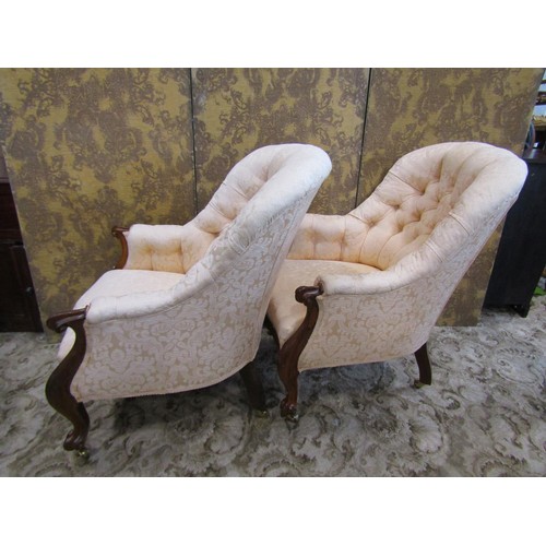 1244 - A pair of 19th century rose wood framed and upholstered drawing room chairs on cabriole legs