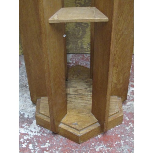 1202 - An unusual lectern in oak, the hexagonal top raised on six shaped supports