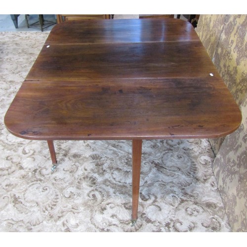 1212 - A 19th century mahogany drop leaf dining table raised on square tapered supports and brass caps and ... 