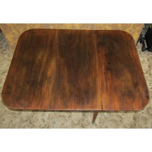 1212 - A 19th century mahogany drop leaf dining table raised on square tapered supports and brass caps and ... 